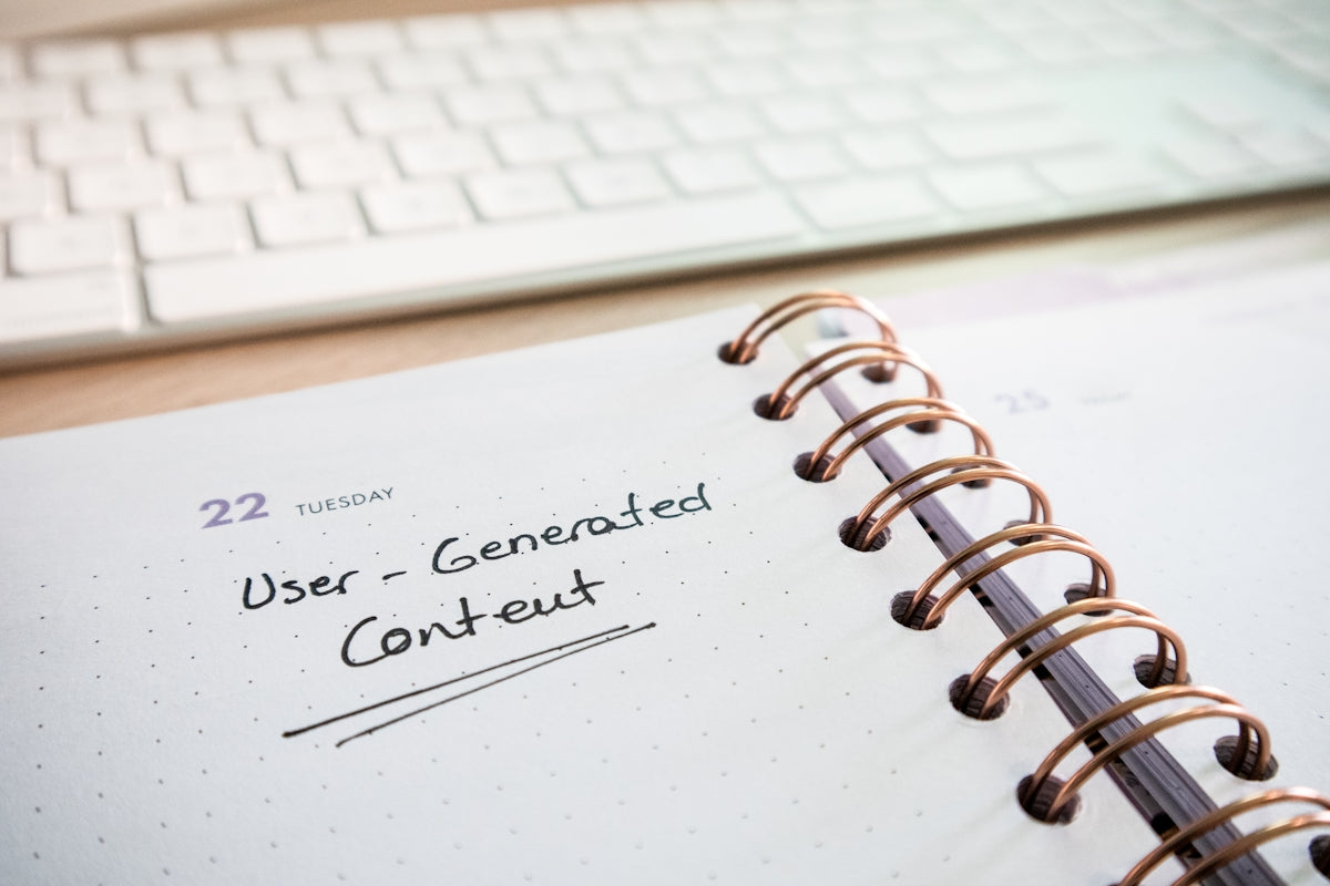 a spiral notebook with the words user - generated content on it
