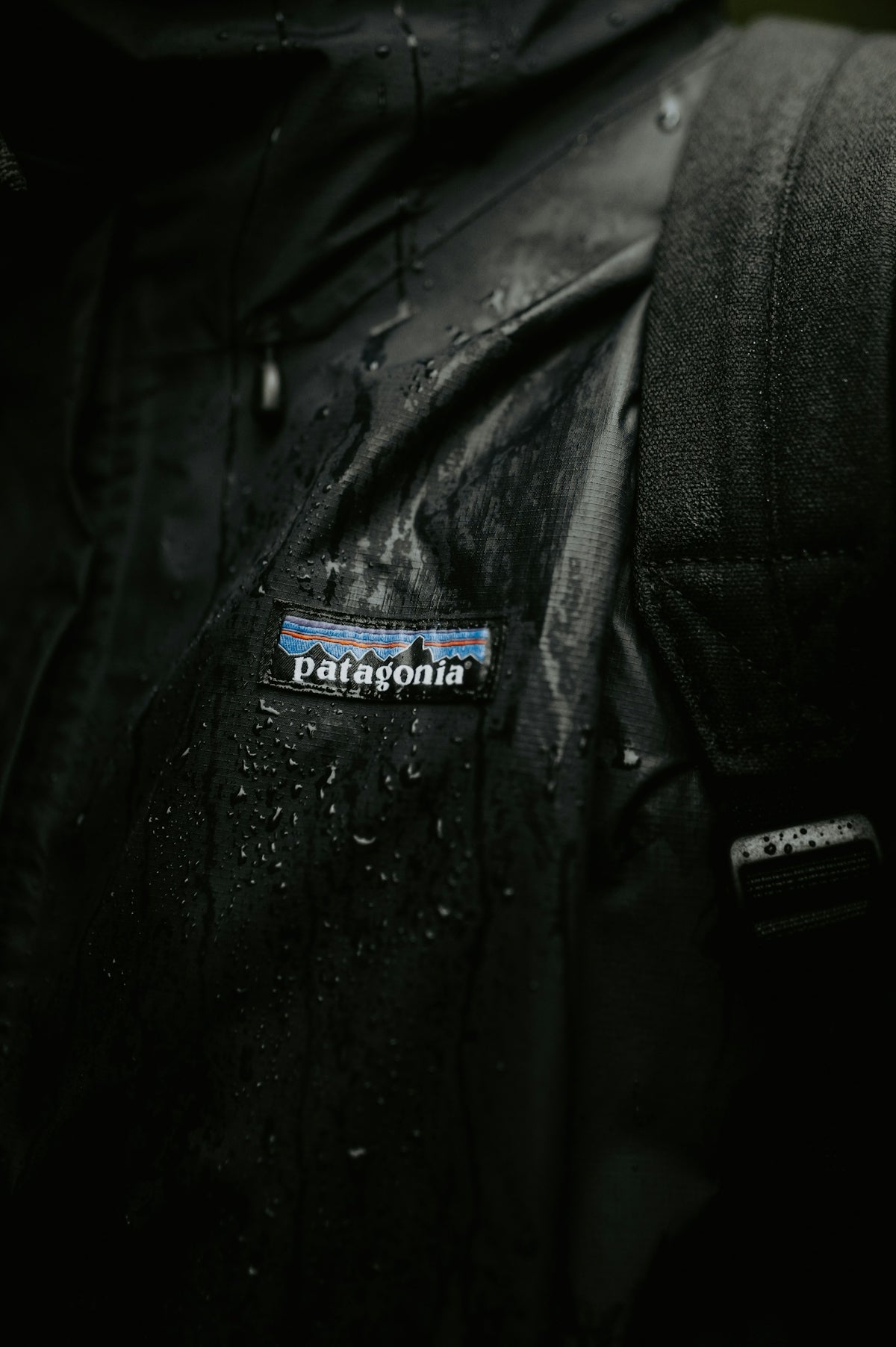 a close up of a person wearing a black jacket